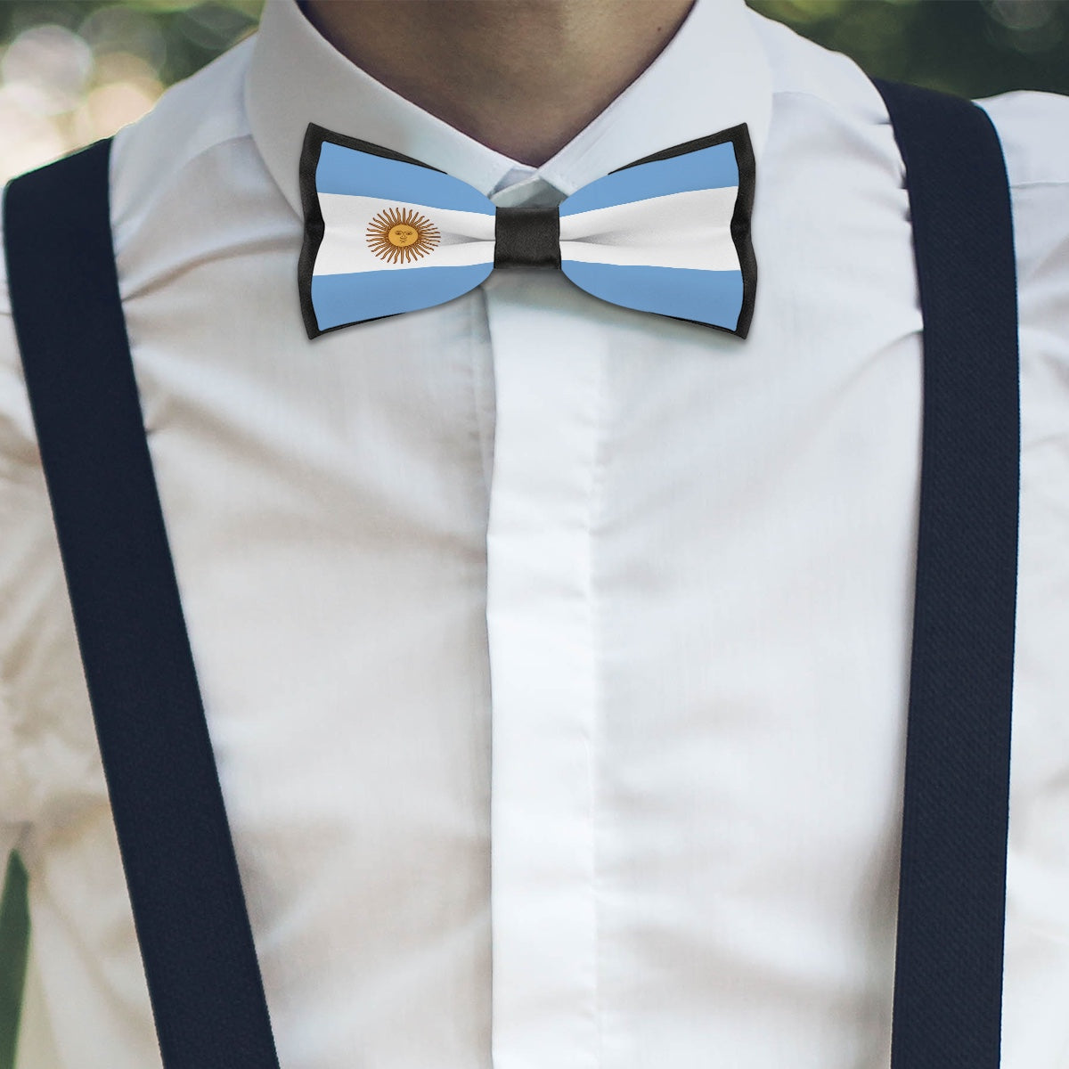White shirt with [Brand]'s Argentina flag-themed bow tie.