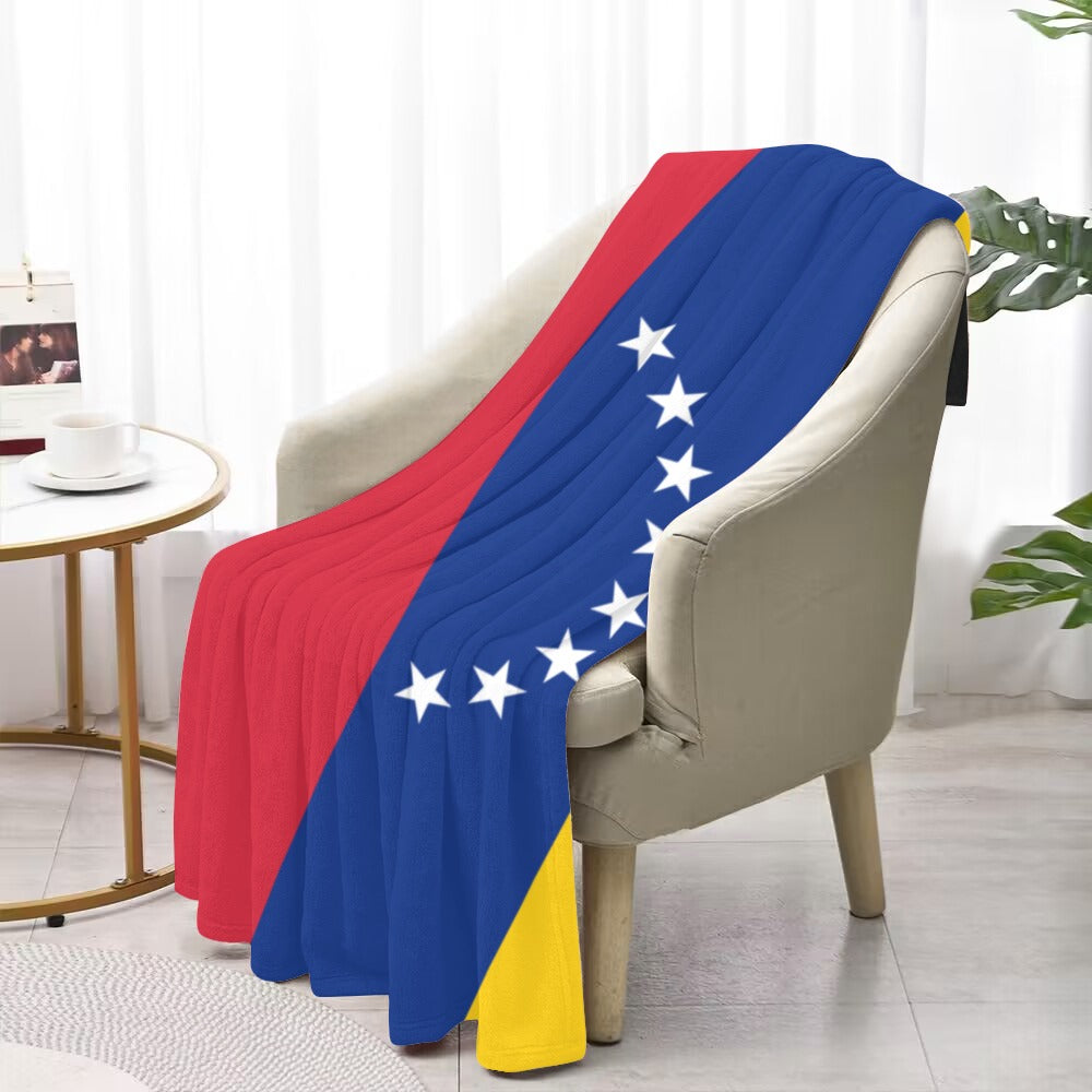Cozy chair with Luv My Flag Venezuelan design blanket.