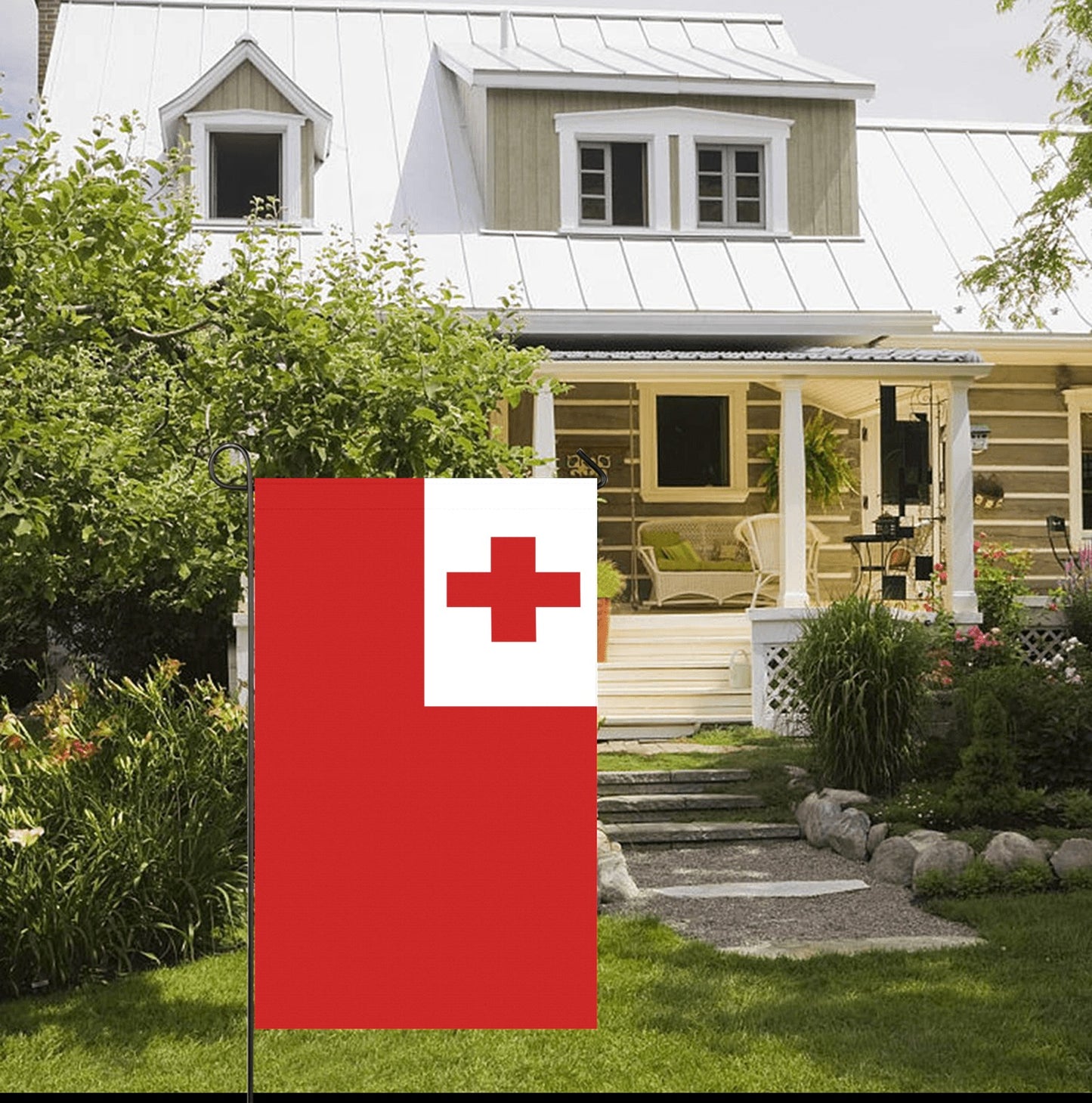 [Luv My Flag] Tonga flag displayed outside charming white house.