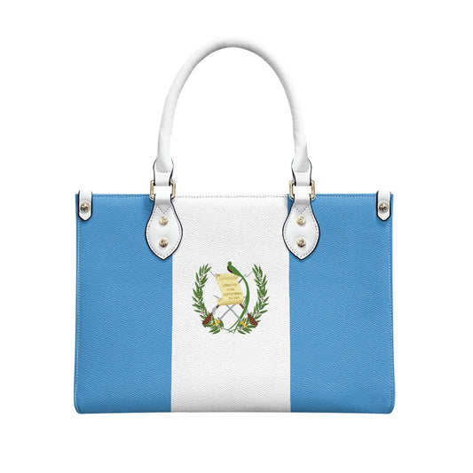 [Brand] bag featuring Guatemala flag design with white handles.