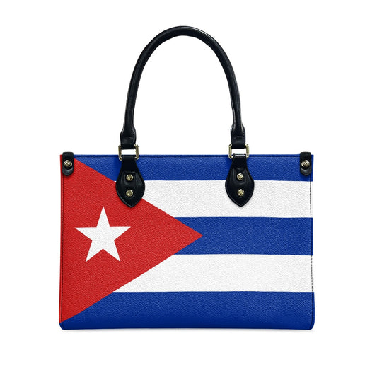 [Brand] handbag featuring Cuban flag design, leather handles attached.