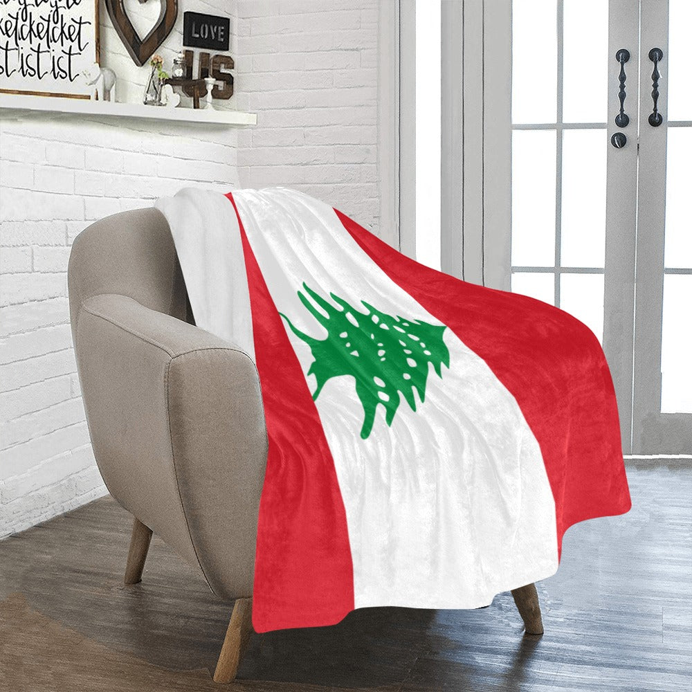 Cozy chair with Luv My Flag Lebanese blanket draped.