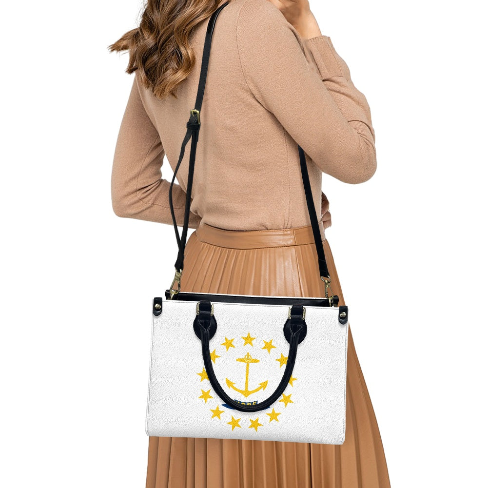 Woman carrying [Brand] bag with anchor design and stars.