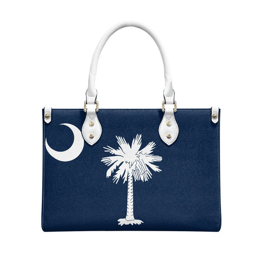 Navy handbag with palm tree logo, white handles, [Brand].