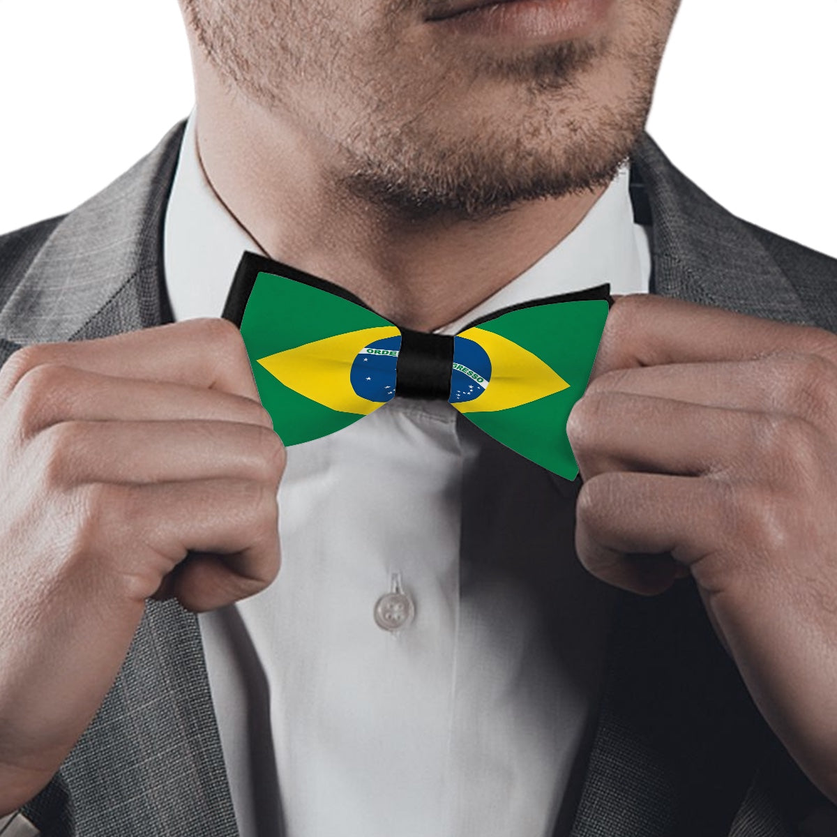 Man adjusting [Brand] Brazil flag bow tie, wearing suit.