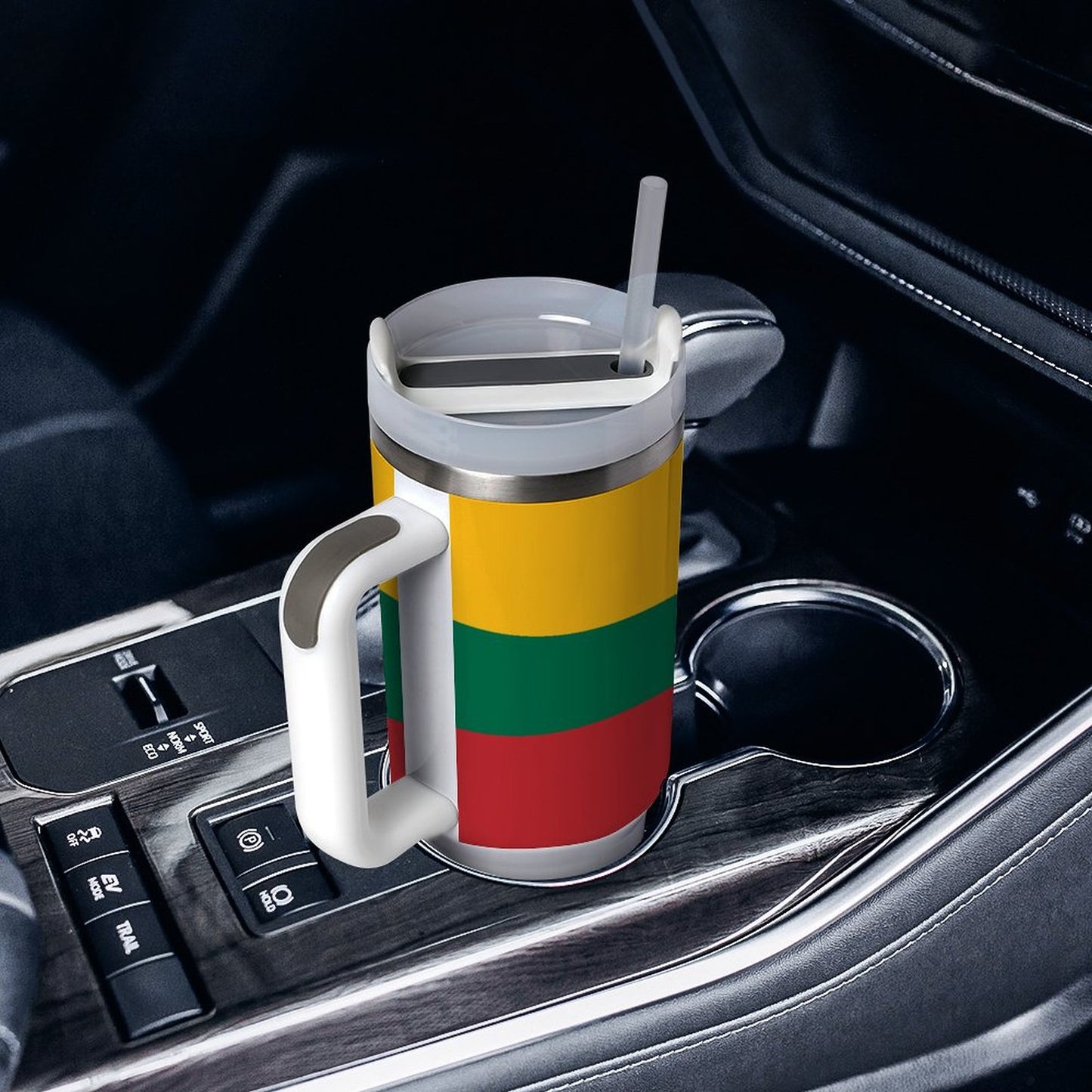 [Brand] travel mug with straw in car cup holder.