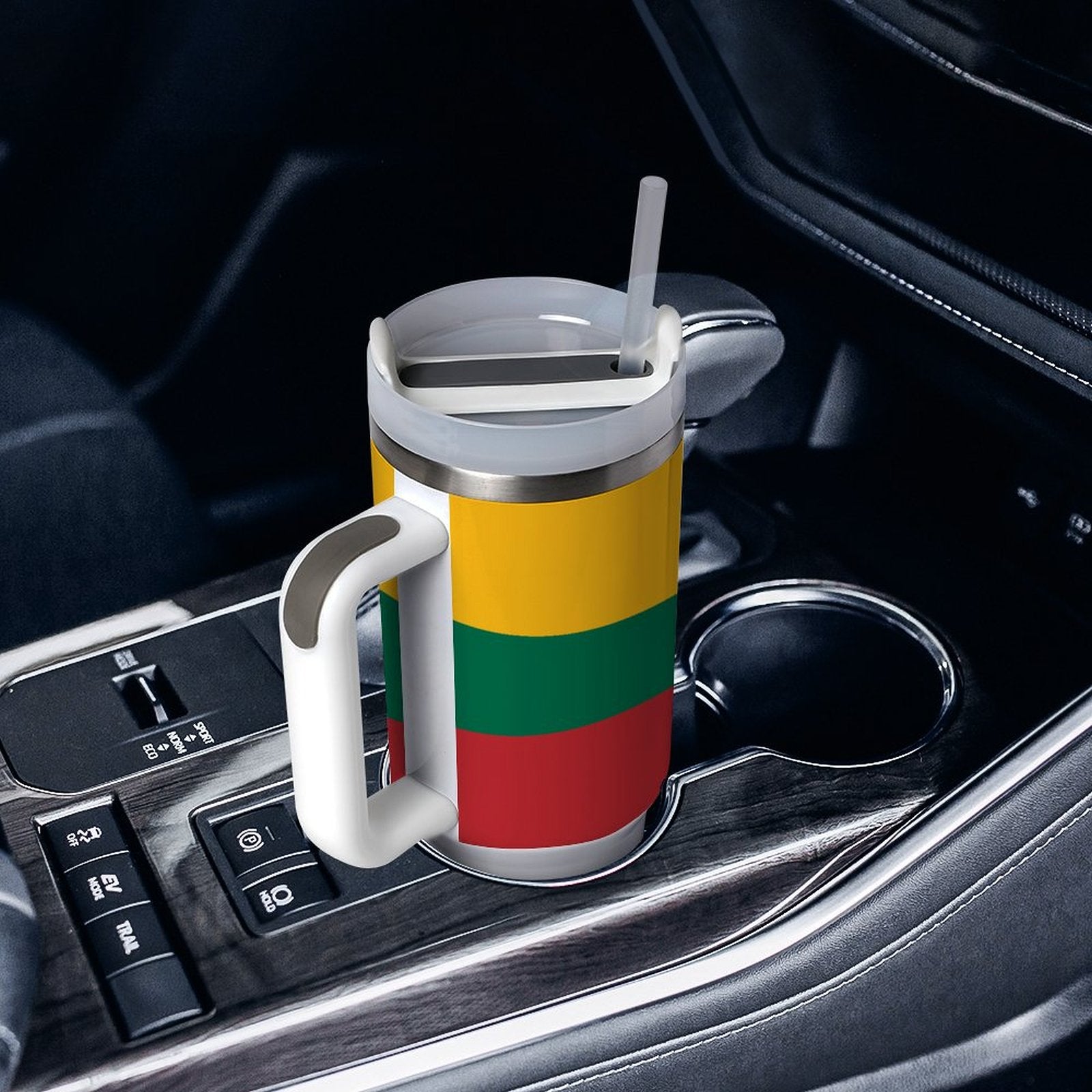 [Brand] travel mug with straw in car cup holder.