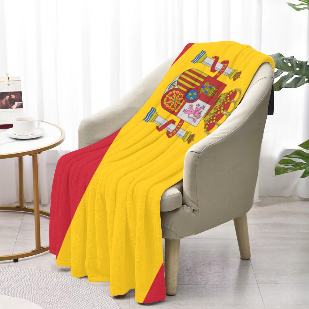 [Luv My Flag] Spain-themed blanket draped over beige chair.