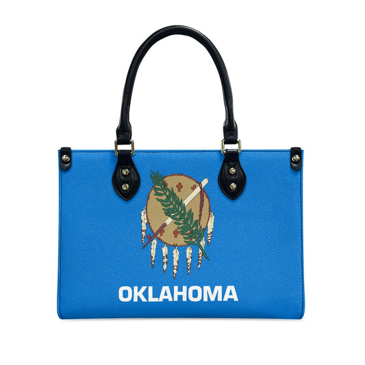 Blue [Brand] handbag with Oklahoma flag design and handles.