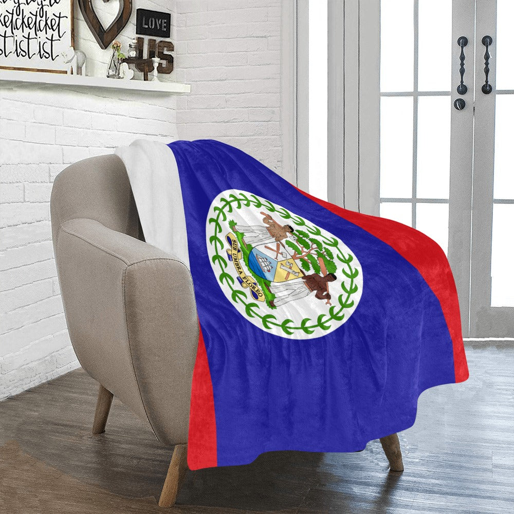 Cozy chair draped with Luv My Flag Belize blanket.