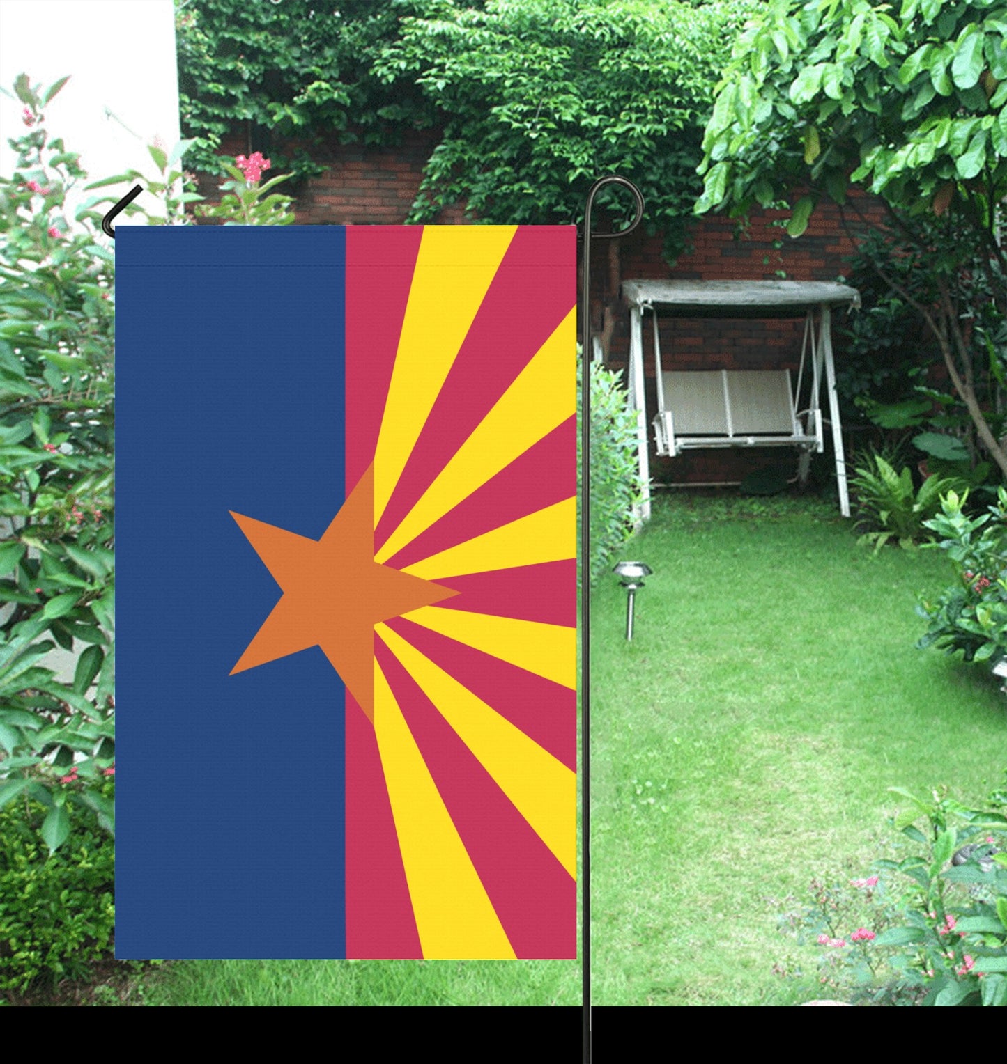 Flag by Luv My Flag displayed in lush garden.