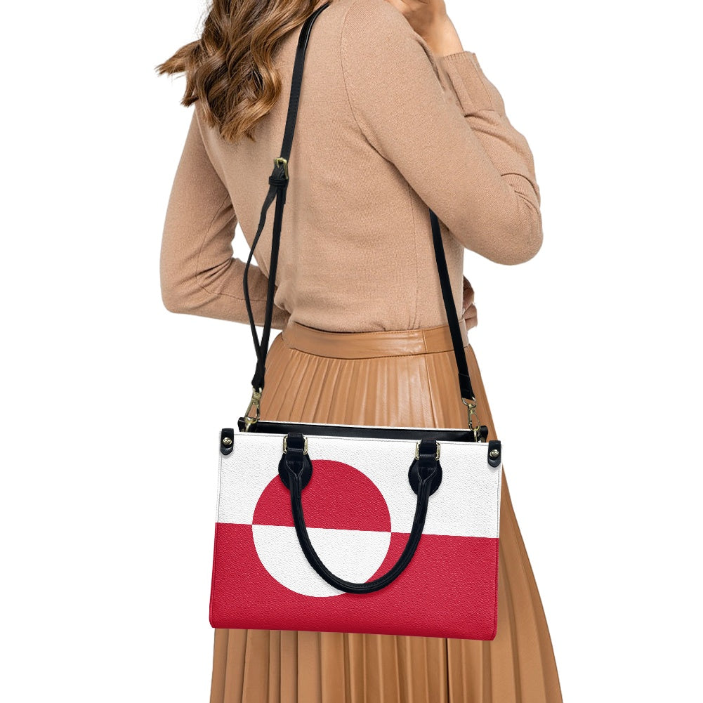 Woman carrying [Brand] handbag with red circle design.