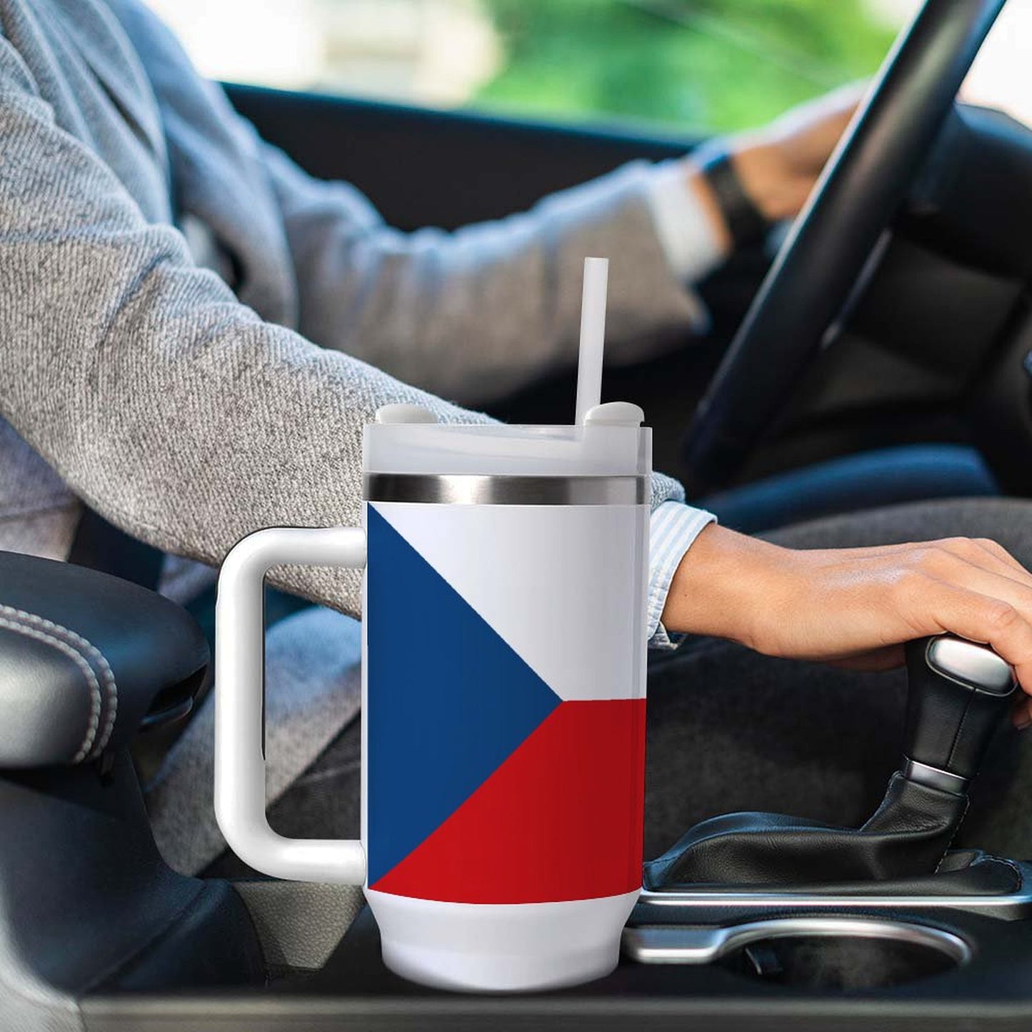 A person holds [Brand] mug with Czech flag design.