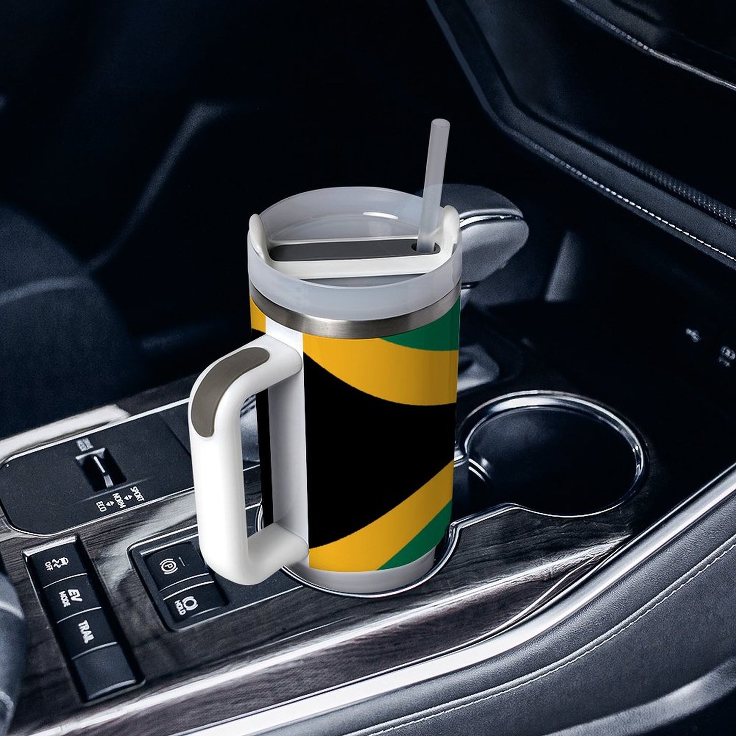 [Brand] travel mug with colorful design in car cup holder.