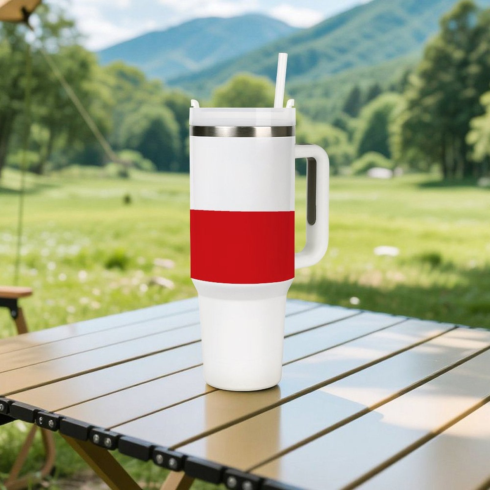[Brand] tumbler with red stripe on outdoor table landscape.