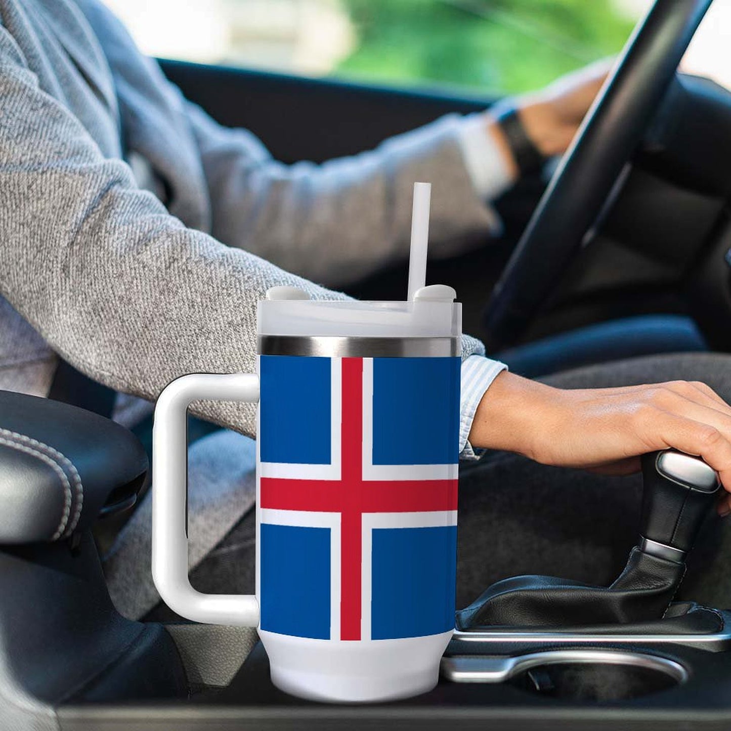 Driver holding mug featuring Iceland flag; branded [Brand].