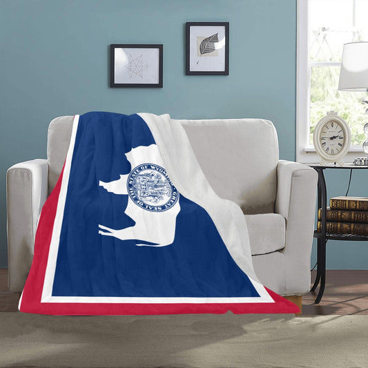 [Luv My Flag] Wyoming-themed blanket draped over cozy couch.