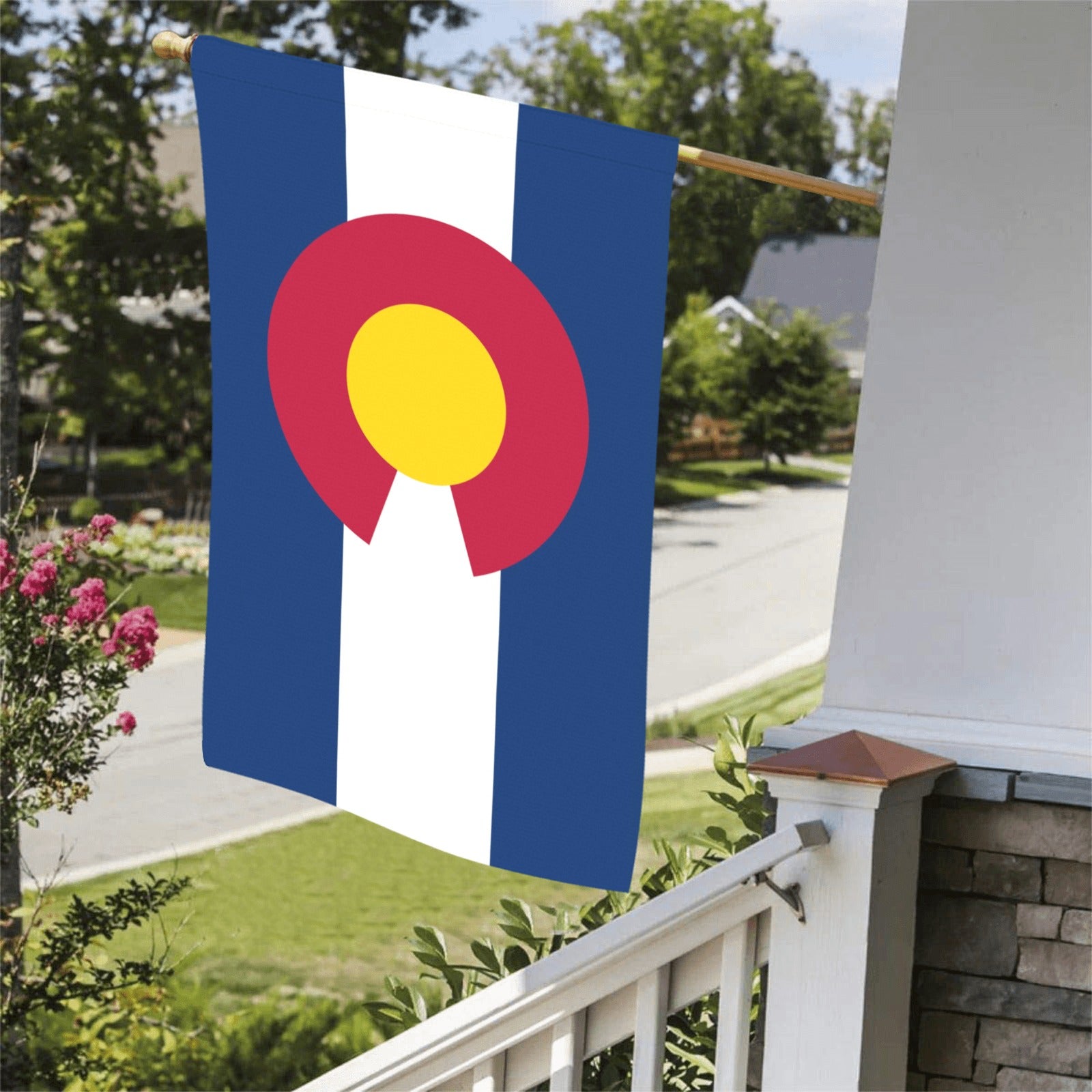 Luv My Flag's Colorado flag displayed on porch railing.