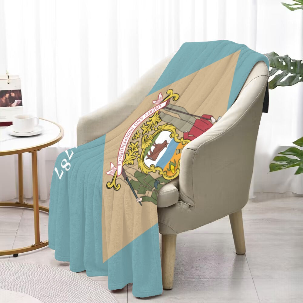 Soft chair draped with Luv My Flag decorative blanket.