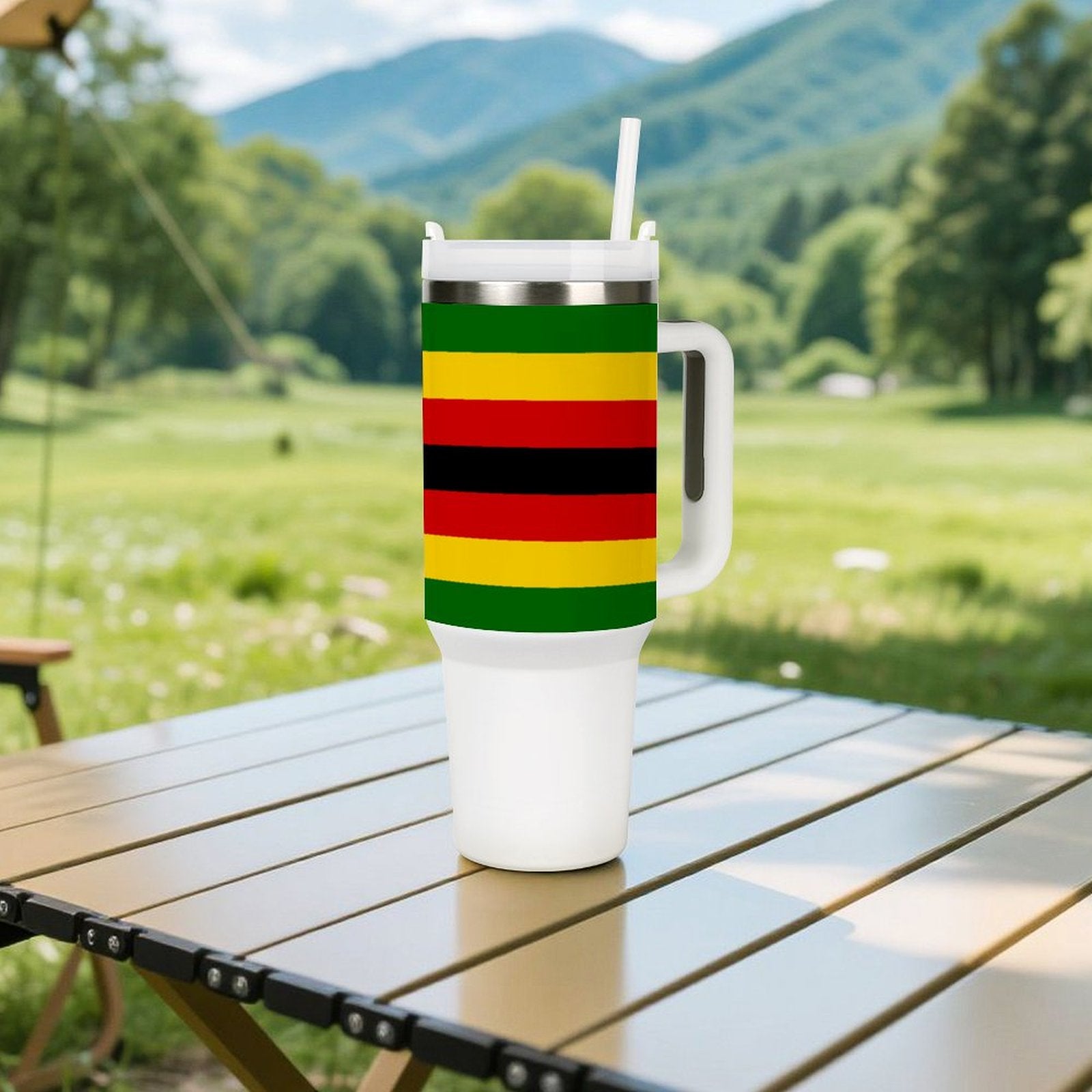 [Brand] tumbler with colorful stripes on outdoor table.