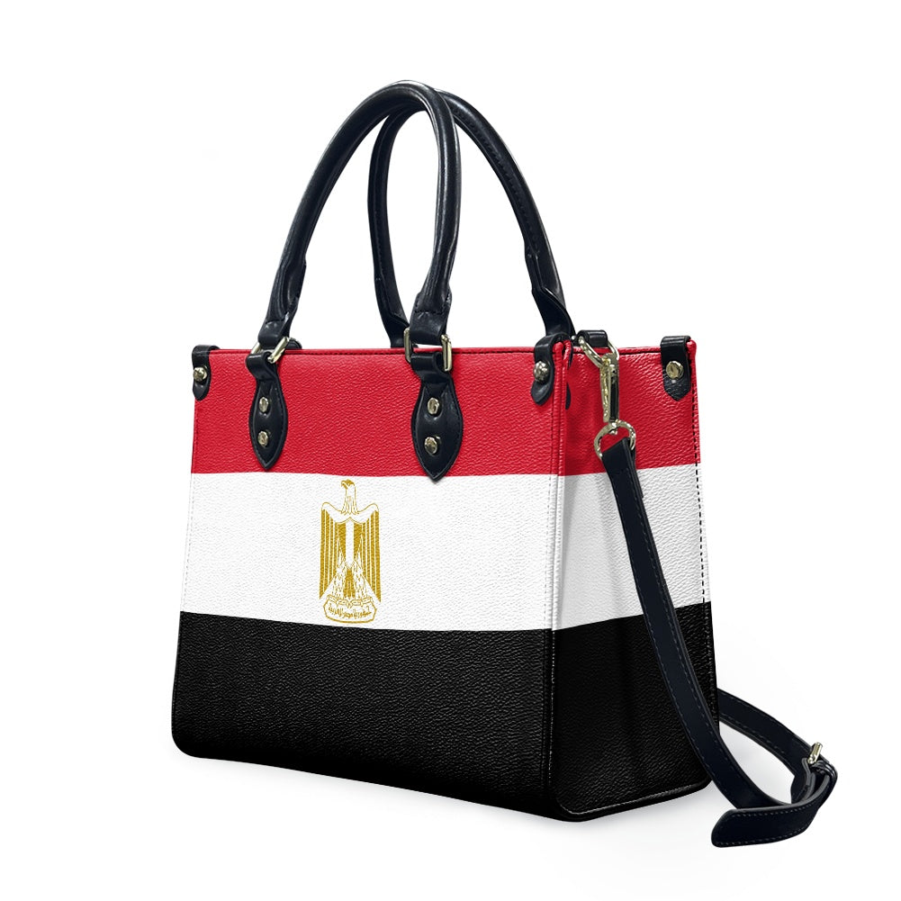[Brand] handbag featuring Egypt flag design with detachable strap.