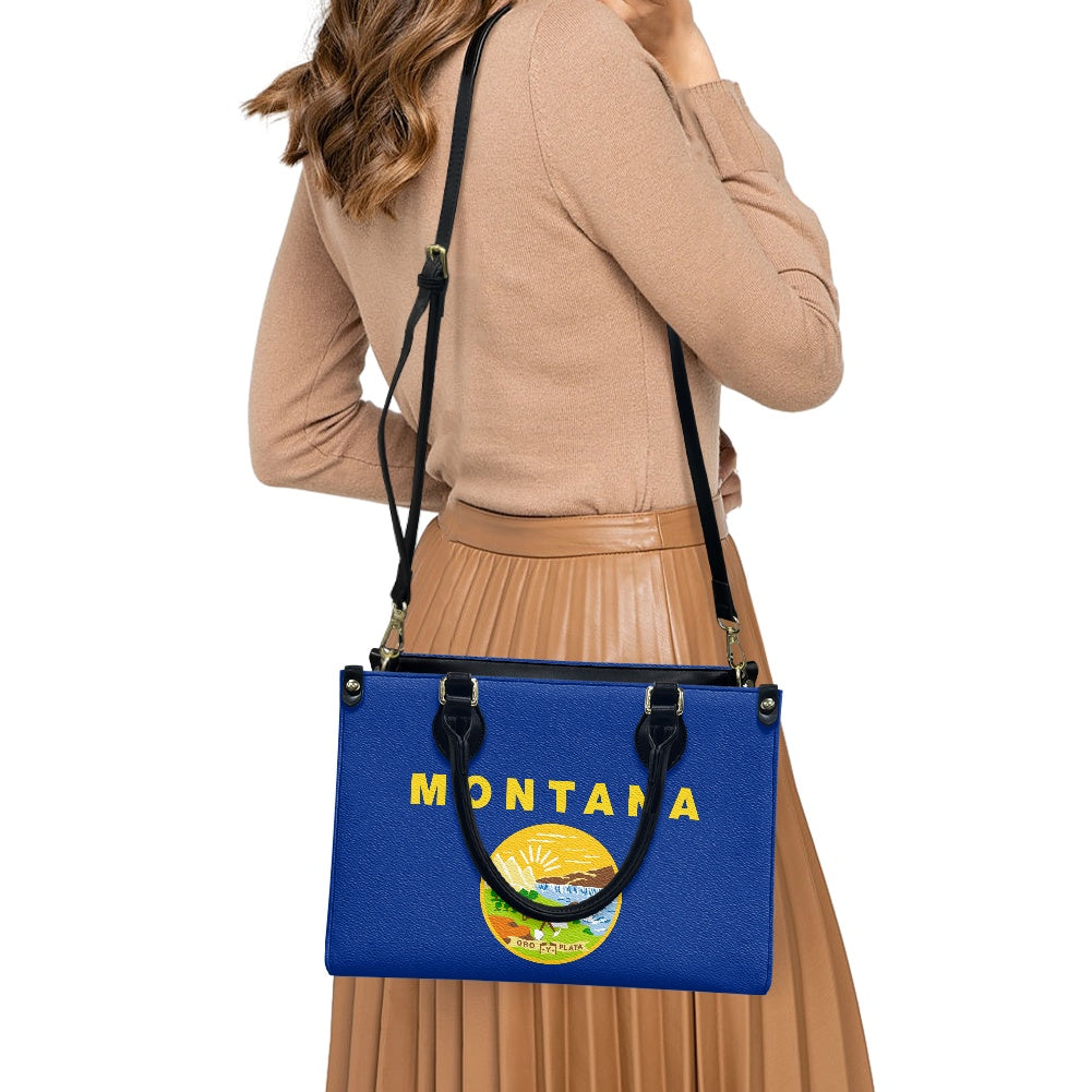 Woman carrying blue [Brand] Montana-themed handbag, beige outfit.