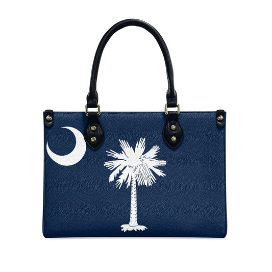 Blue [Brand] handbag with white crescent and palm design.