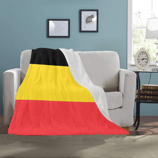 Cozy [Luv My Flag] Germany blanket draped over sofa.