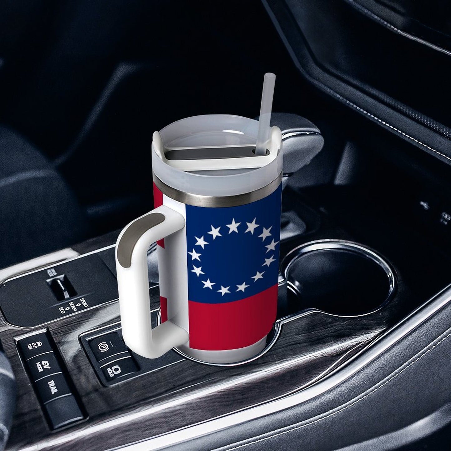 [Brand] travel mug with patriotic design in car cup holder.