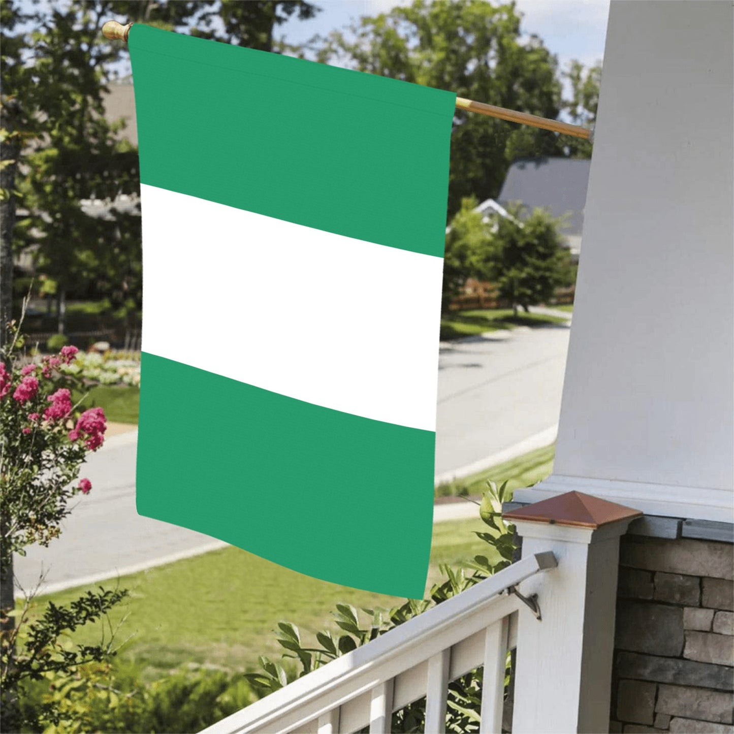 Luv My Flag's green and white flag on porch.