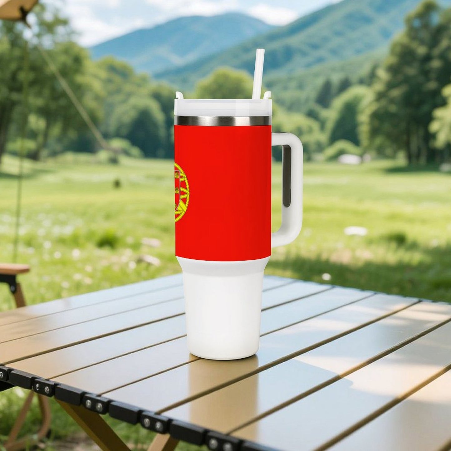 Red and white [Brand] tumbler with straw on table outdoors.