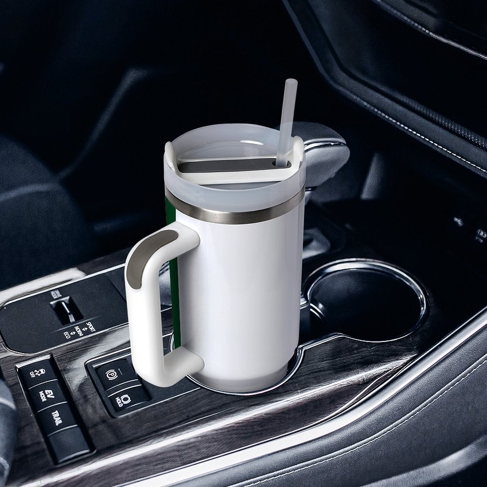 [Brand] white tumbler with handle in a car cupholder.