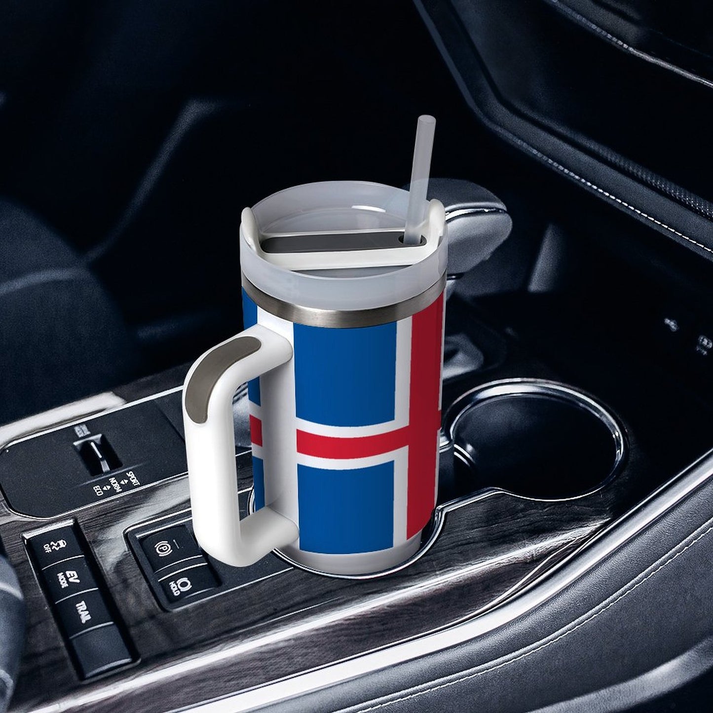 [Brand] travel mug with Icelandic flag in car cup holder.
