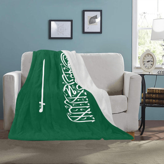 "Luv My Flag blanket on sofa, green with white script."