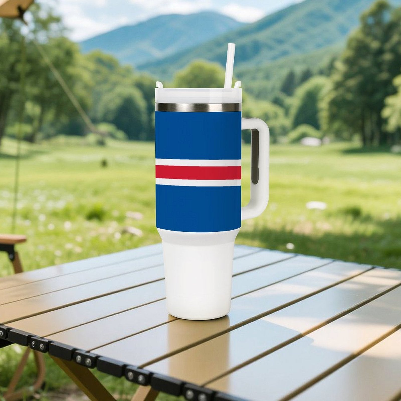 [Brand] travel mug with handle on outdoor wooden table.