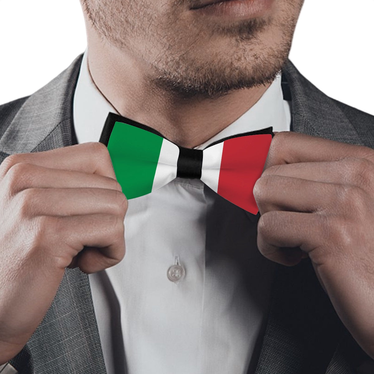 Man in suit adjusting [Brand] Italian flag bow tie.