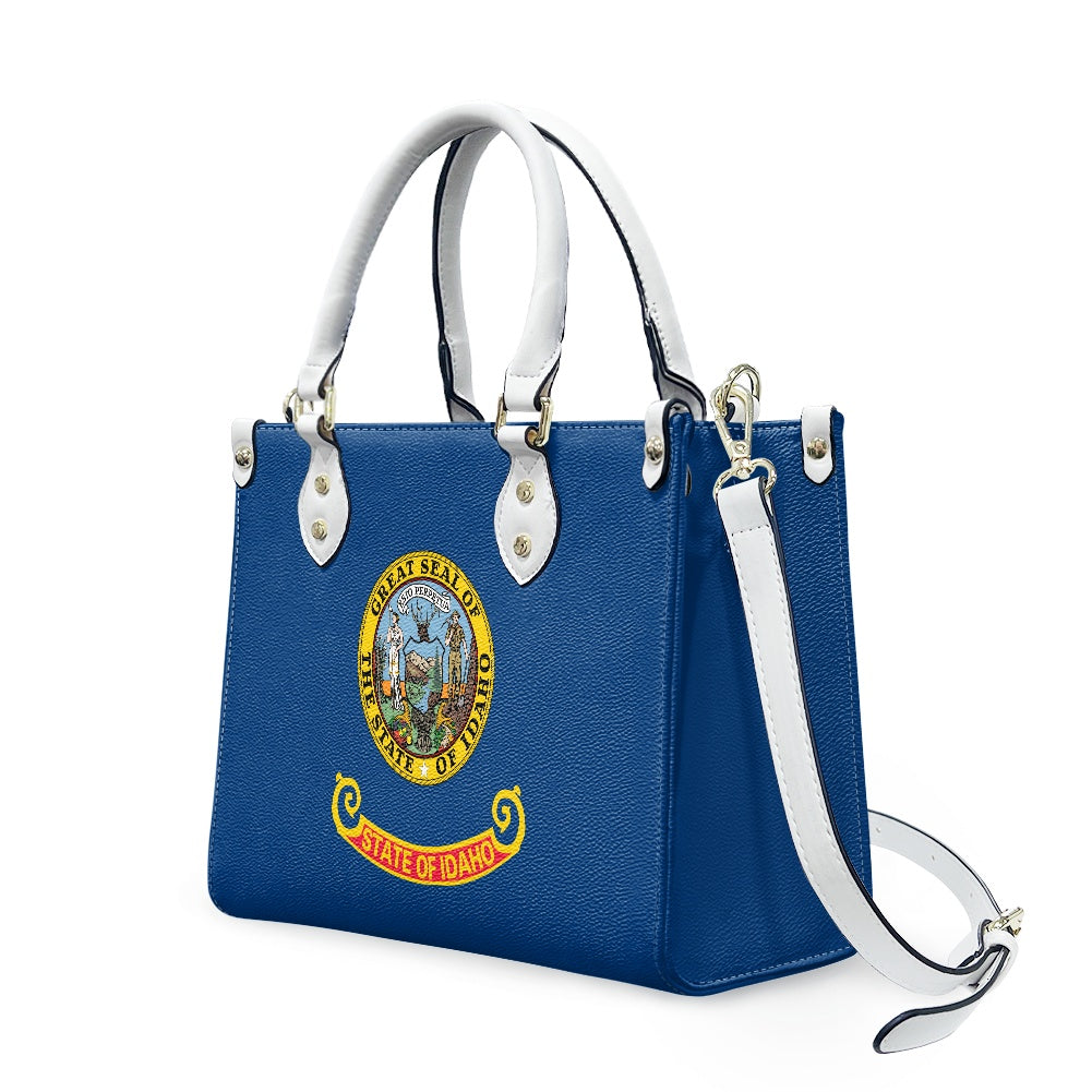 Blue handbag with Idaho seal, white handles, [Brand].