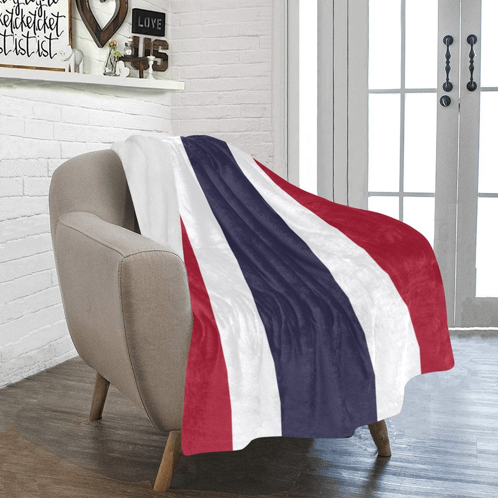 Cozy armchair draped with Luv My Flag patriotic blanket.