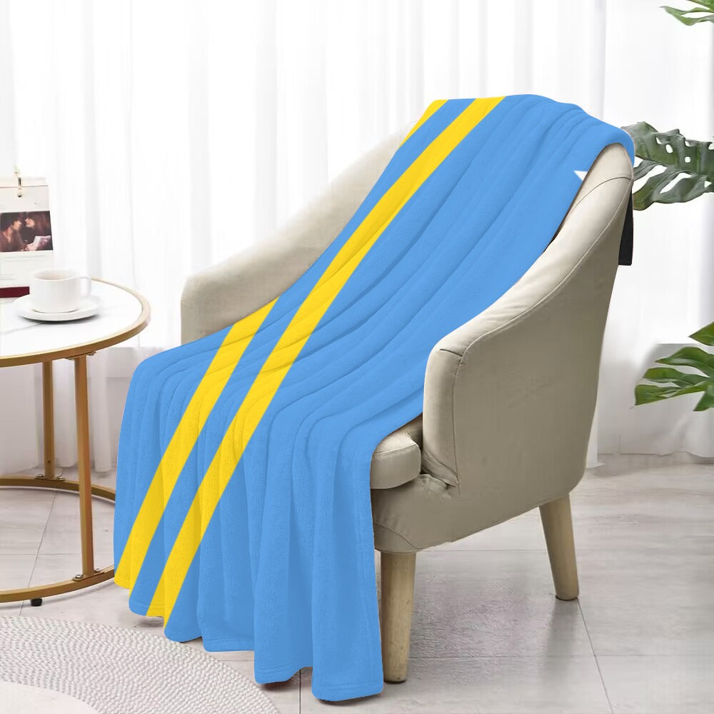 Blue and yellow blanket draped over chair, Luv My Flag.