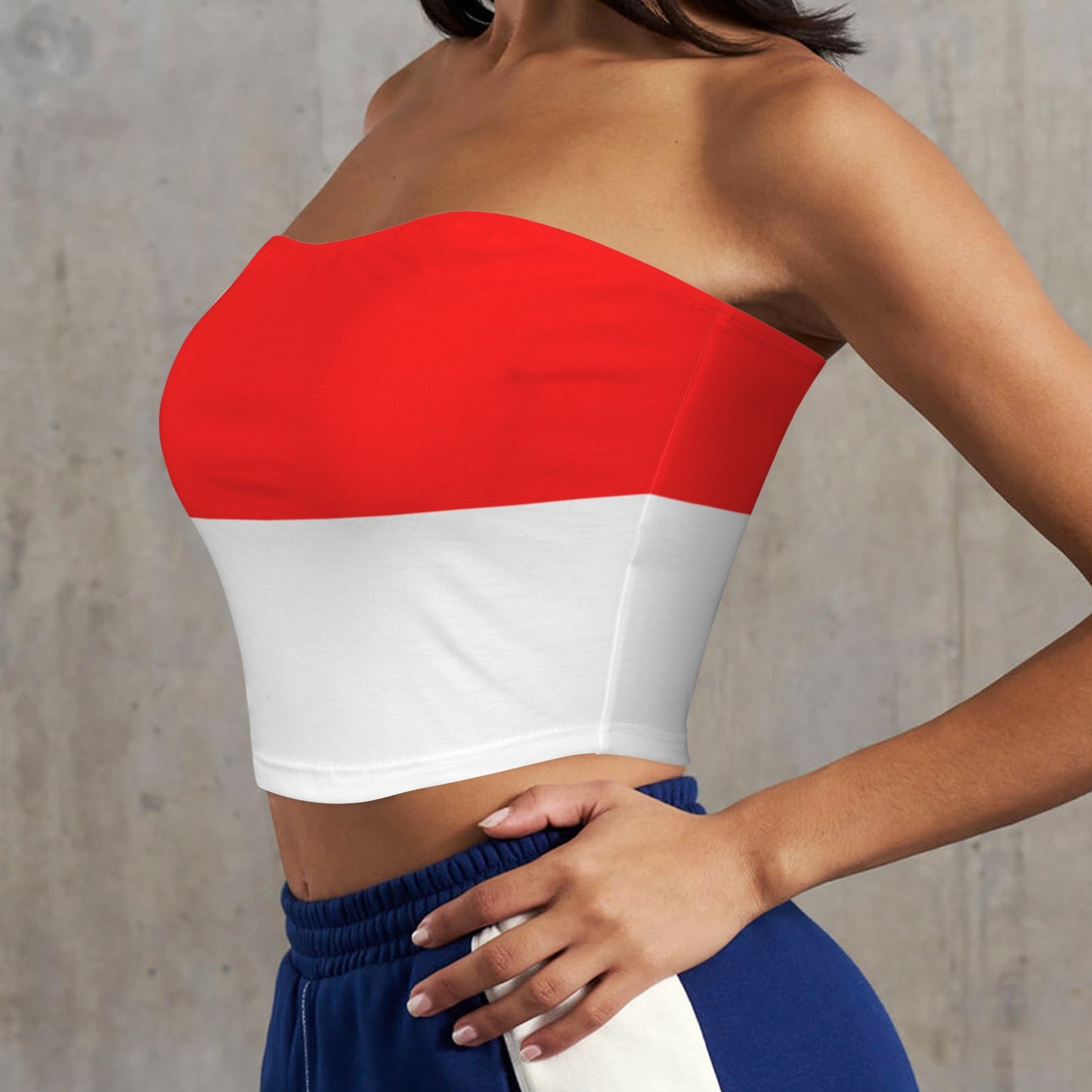 Person wears [Brand] red and white strapless crop top.