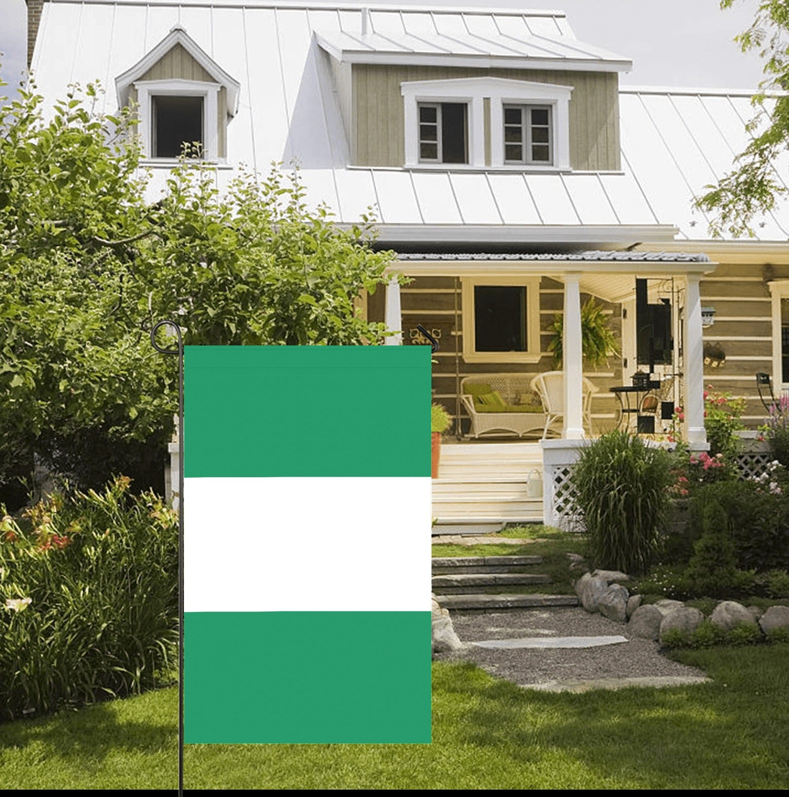 Green and white flag by Luv My Flag in garden.