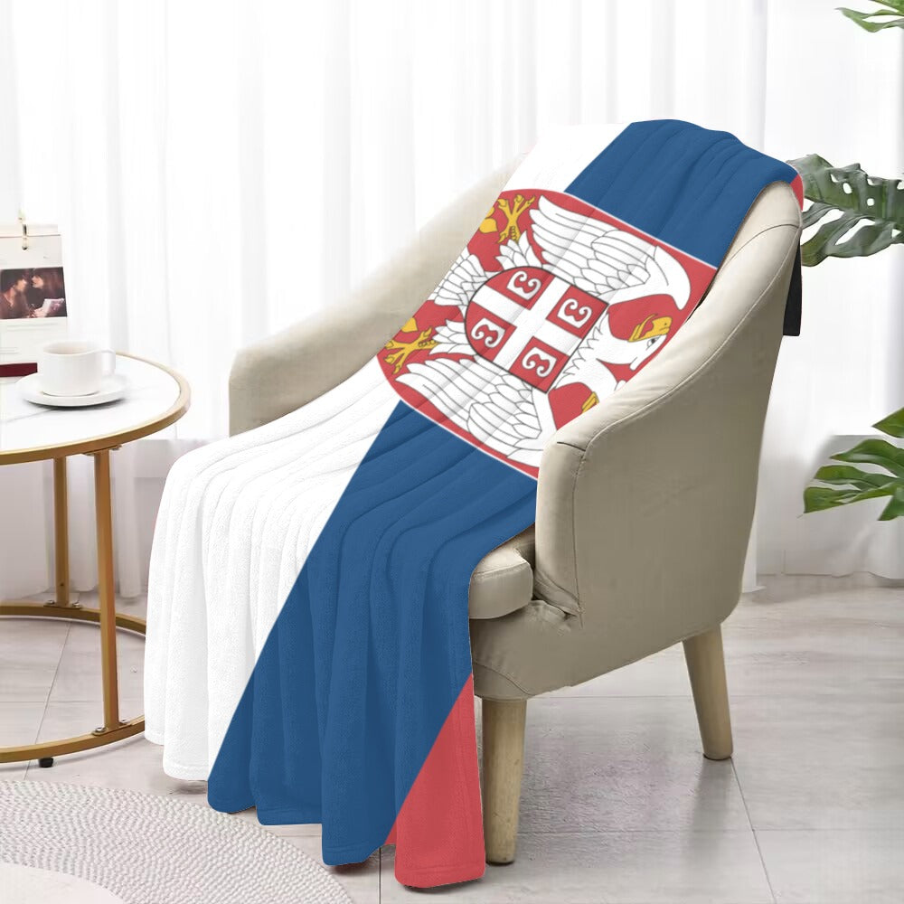 Cozy chair draped with Luv My Flag Serbian blanket.