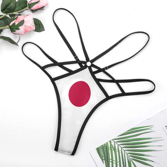 White thong with black straps and red circle design. [Brand]