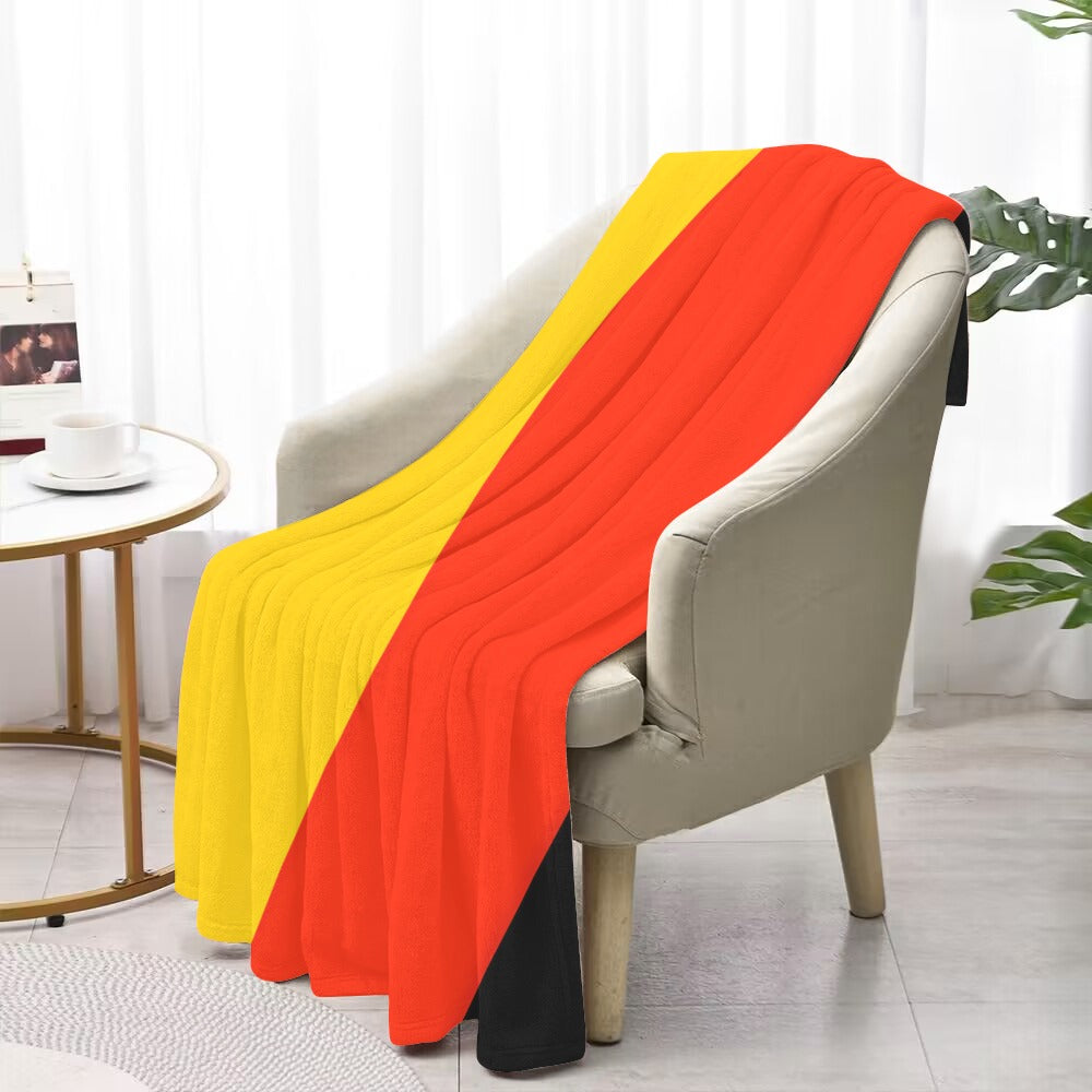 [Luv My Flag] blanket with red, yellow, black stripes.