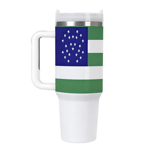 [Brand] mug with green and blue geometric pattern design.
