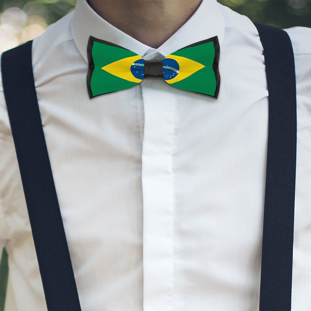 Person wearing Brazilian flag bowtie with black suspenders, [Brand].