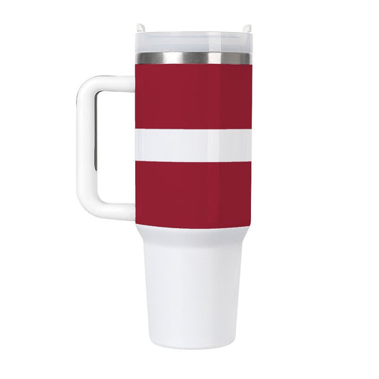 Red and white [Brand] travel mug with a handle.