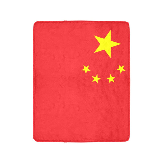 Red blanket with yellow stars, resembling Chinese flag. Luv My Flag.