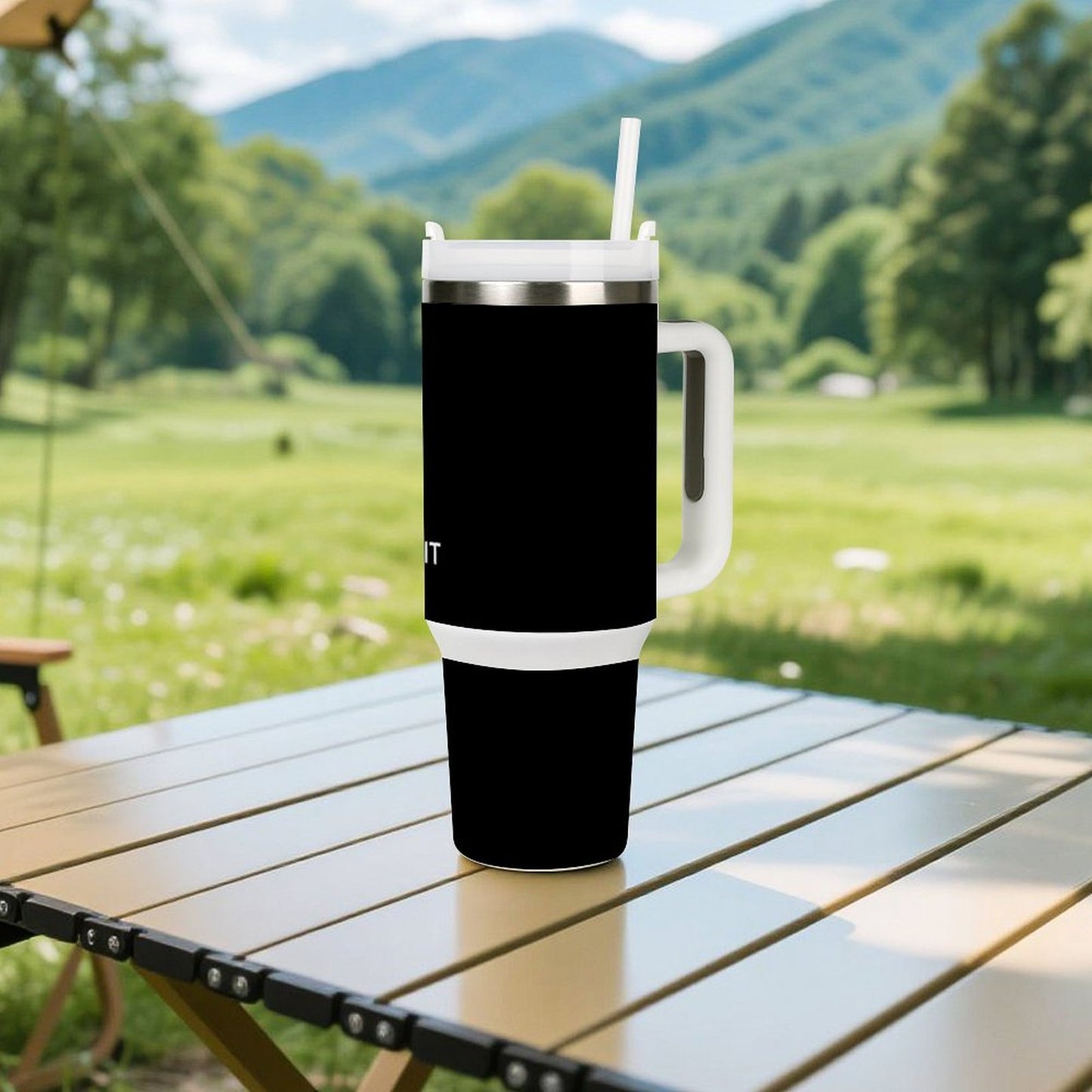 Outdoor scene featuring a black [Brand] tumbler on table.