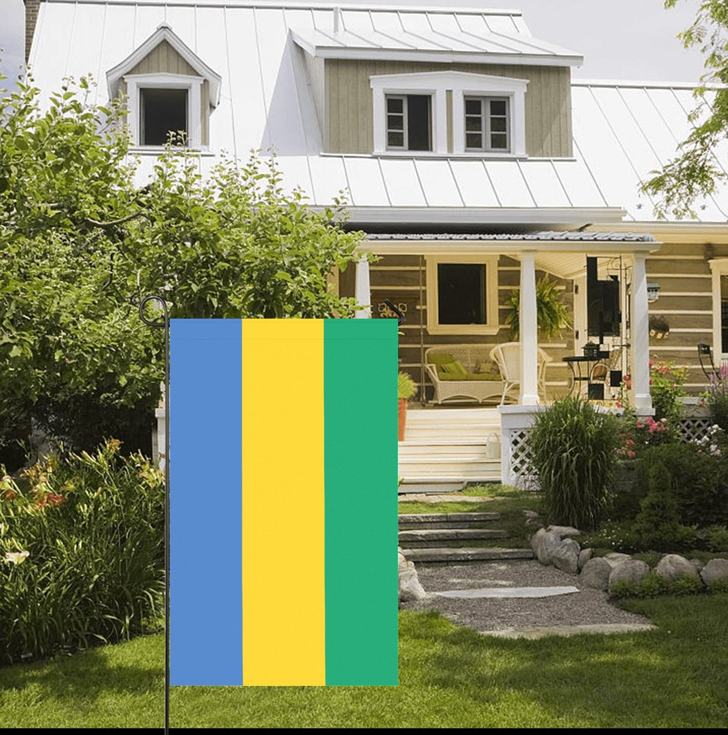 [Luv My Flag] colorful flag outside a charming country house.